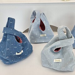5461かわいい新型カウボーイのハンドバッグ携帯収納外出手首バッグ衝突色赤格手提げバッグ