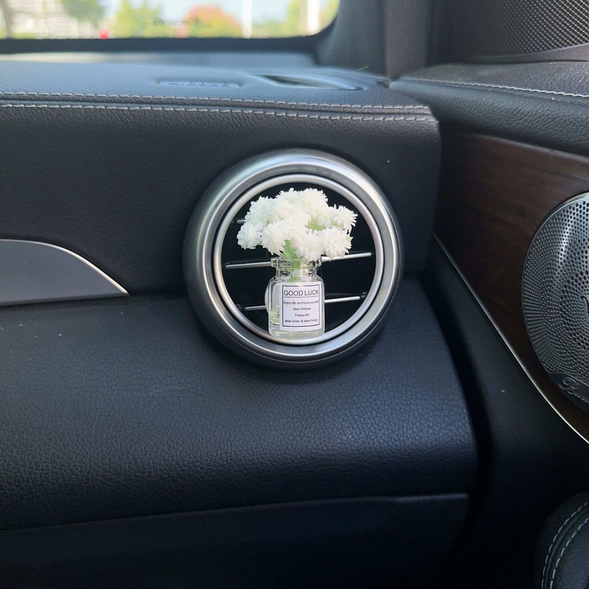 Decoración creativa de salida de aire del automóvil con flores de estrellas pequeñas frescas aire acondicionado botella de perfume de perfumes