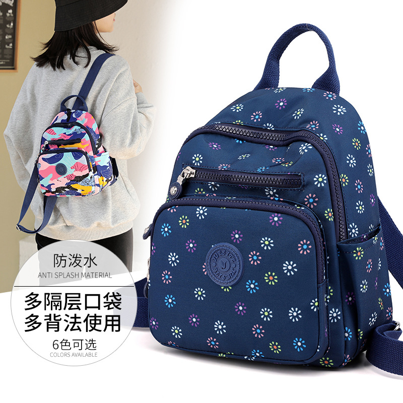Fábrica al por mayor impermeable nylon mochila moda mujer pequeña mochila popular mediano y grande estudiantes bolsa casual