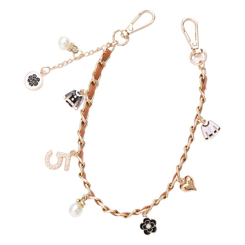 Yilian nuevo estilo de Chanel estilo de cinco palabras Cadena de cuero de la perla portátil cadena de la muñeca bolsa colgante de la caja del teléfono colgante de la joyería