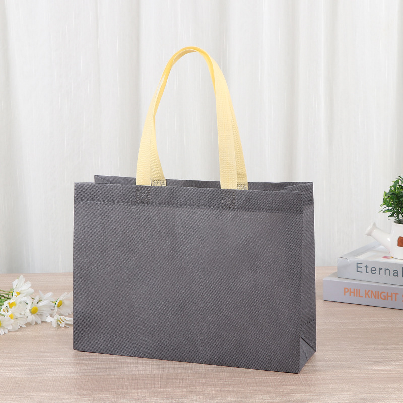 Bolsas de tela no tejida tiendas de souvenirs de viajes de madres y bebés en línea bolsa de compras de mano engrosada bolsa de mano image 15