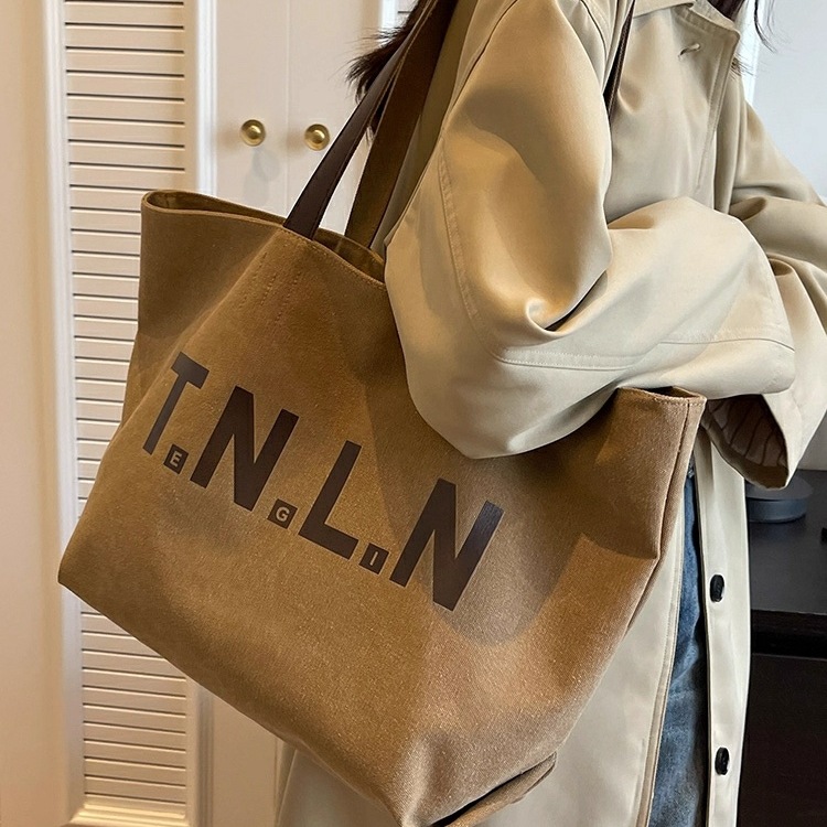 大容量帆布包包女2025秋新款小众上班电脑通勤包高级感单肩托特包