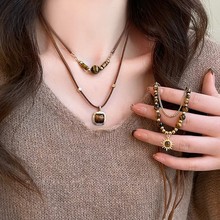 秋冬款美拉德咖色虎眼石项链女长款流苏太阳花毛衣卫衣链网红颈链