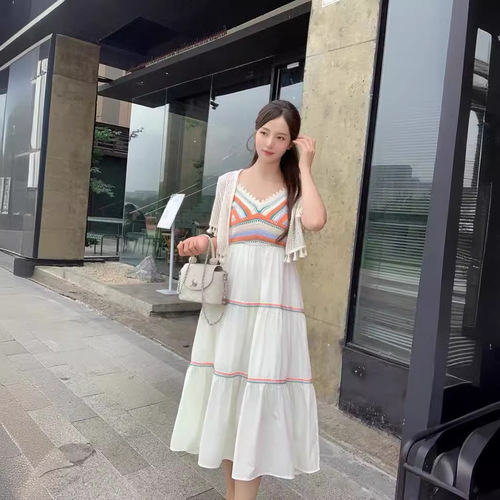Retro ethnic-style designer V-neck knitted sweater with patchwork, paired with a long beach-style slip dress—women's clothing.