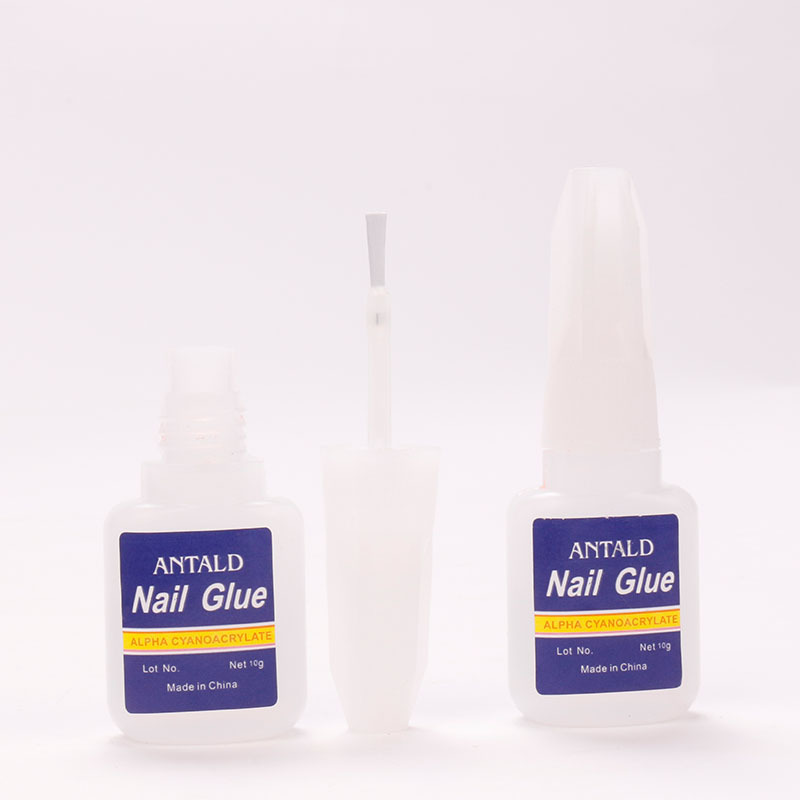 Suministros transfronterizos pegamento de uñas al por mayor 10g botella azul pegamento de uñas con cabeza de cepillo adhesivo de secado rápido pegamento de diamante pegajoso fuerte