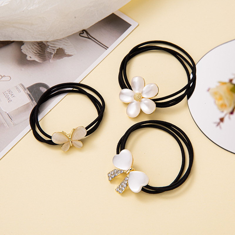 탄성 가죽 밴드 헤어 액세서리 이우 제조 업체 재고 도매 한국어 간단한 모조 고양이의 눈 모조 다이아몬드 색상 활 머리 반지