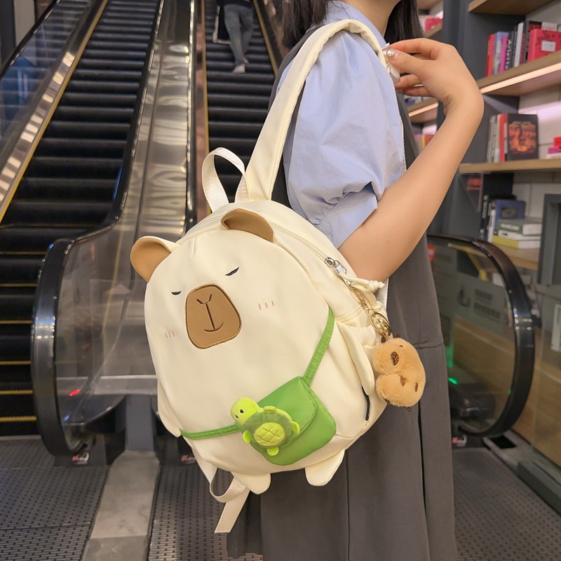 Mochila japonesa encantadora de dibujos animados 2024 nueva extraña mochila de muñeca de gran capacidad de muñeca de estudiantes