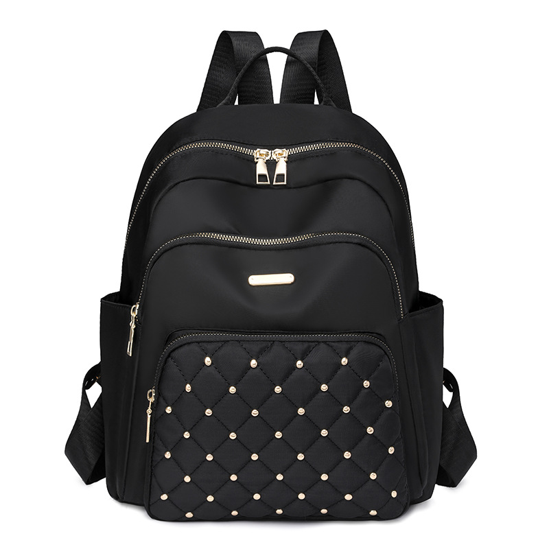 Comercio exterior al por mayor 2024 nuevo estilo casual señoras Lingge mochila moda remache color contraste mochila ligera mochila escolar marea