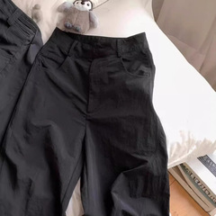 アメリカのレトロな黒色の速乾の工装のズボンの女性の夏の薄いタイプの高い腰の垂れ下がっている感じの広腿のズボンのゆったりとしている長いズボン