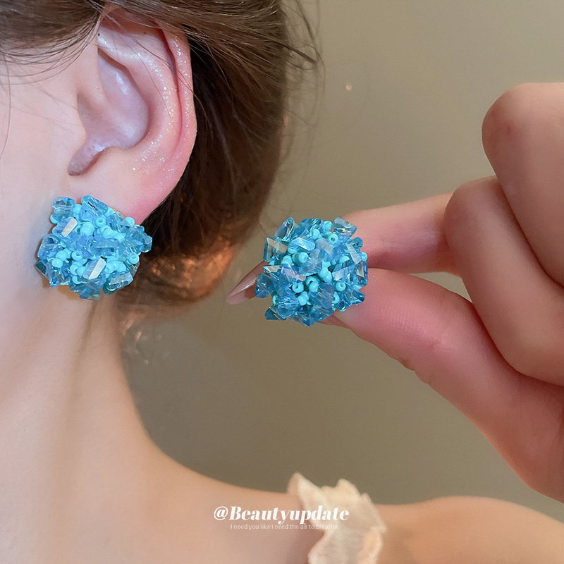 Pendientes de tejido de cristal de flor redonda de aguja de plata Pendientes de todo fósforo de viaje Pendientes de temperamento de moda femenina Sensación de nicho de alto nivel