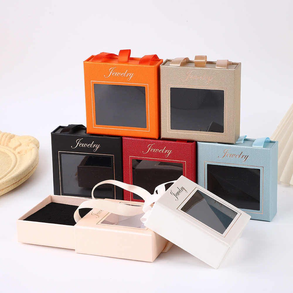 Cajas de joyería de alta gama en stock para pendientes, pulseras, collares y anillos; cajas extraíbles para almacenamiento de joyas al por mayor.