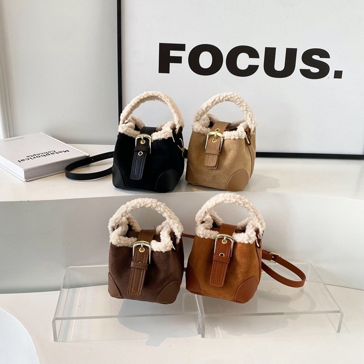 Otoño y invierno nuevo bolso infantil de lana de cordero Meilade mini bolso de cubo retro mochila mochila de mujer
