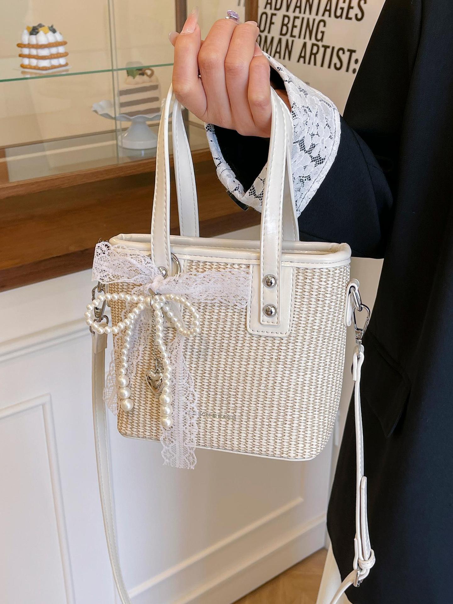 Bolsa de balde de mano caliente de verano para mujeres 2025 nueva bolsa de playa de vacaciones de playa bolsa de tejido bolsa de paja