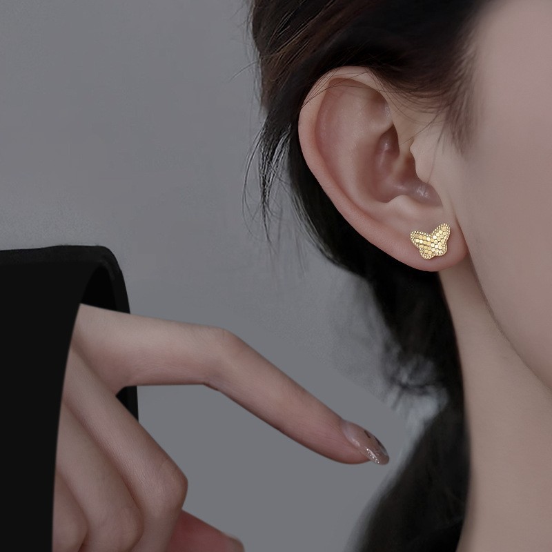 Pendientes de flores tridimensionales con lentejuelas de aguja de plata Pendientes de lujo ligero de alta gama de moda de nicho Pendientes de viento frío al por mayor