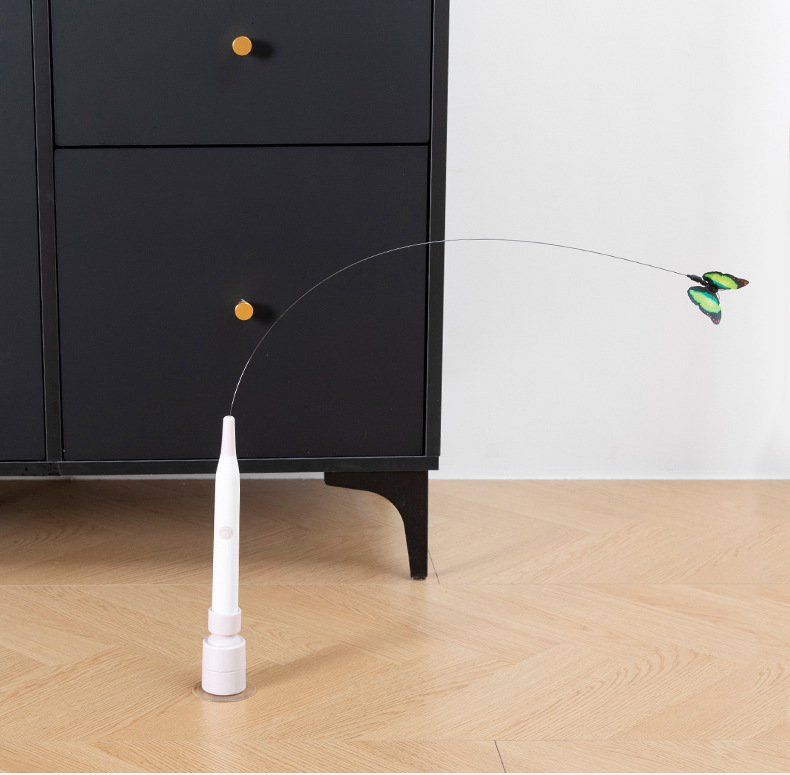 Suction mount cat teaser attached to tile surface