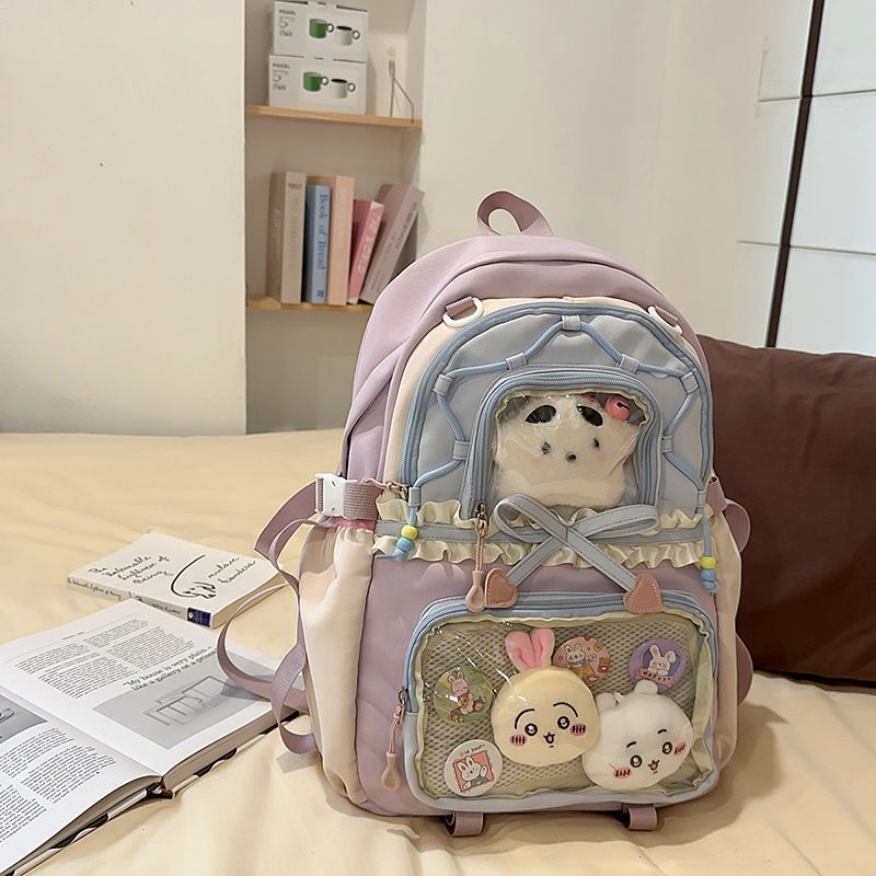 보라색 백팩 (인형 2개 + 뱃지 4개 + 눈썹별 1개 포함)