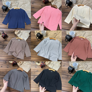 Small and medium-sized children's spring and autumn 2025 new cotton long sleeve T-shirt boys and girls baby solid color base shirt a generation of hair