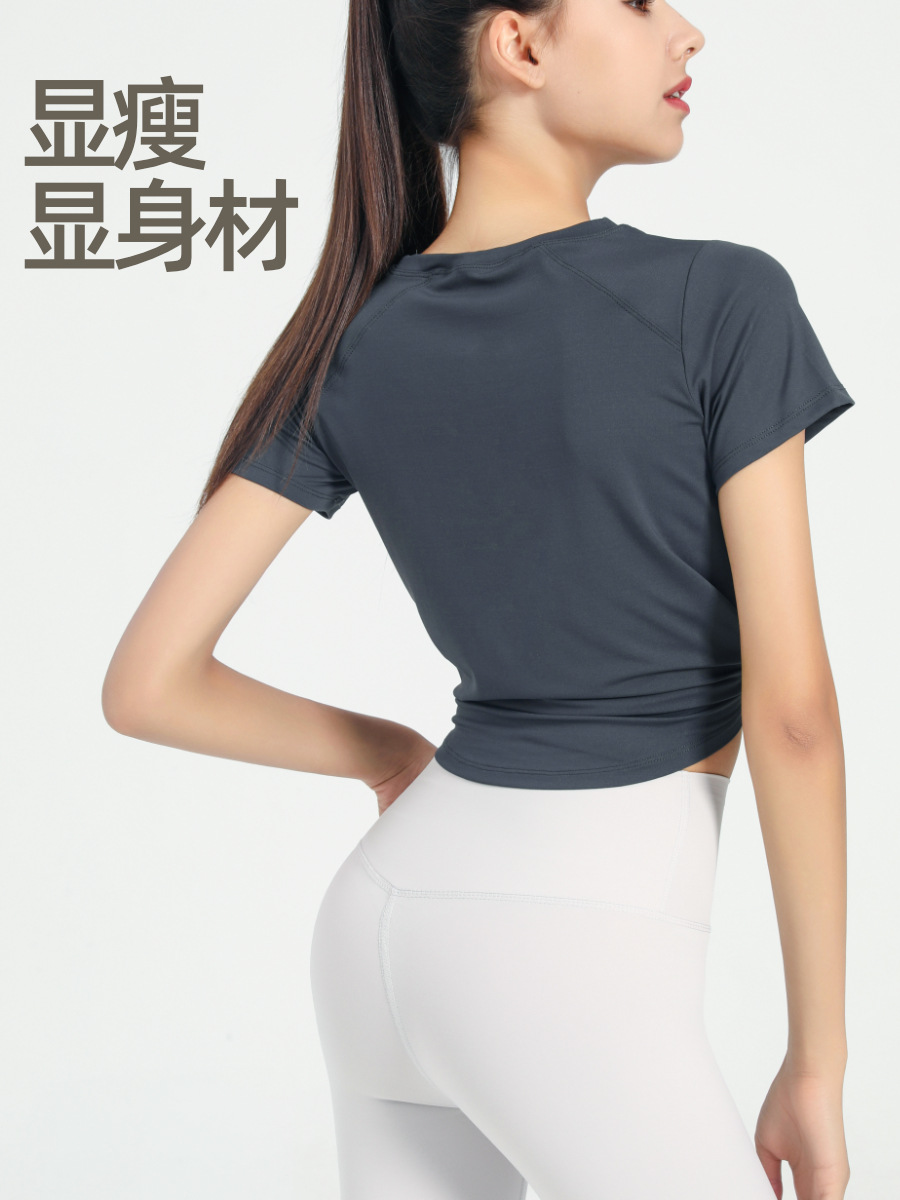 Nuevo verano suelto fitness deportes de manga corta Camiseta de mujer de color sólido europeo y americano de secado rápido irregular yoga Top blusa