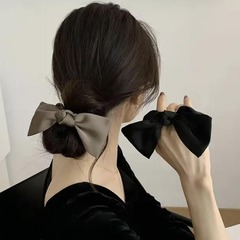 黒い蝶結びの髪飾りのサテンの大腸輪の後頭部の髪輪の高弾力性の髪ひものリボンの髪飾りの女性の夏