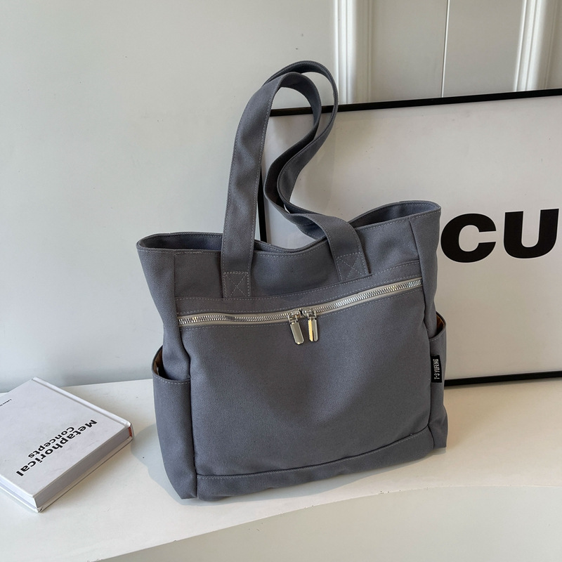 인기있는 학생 캔버스 어깨 가방 2024 새로운 패션 대용량 휴대용 어깨 가방 클래스 통근 언더암 가방