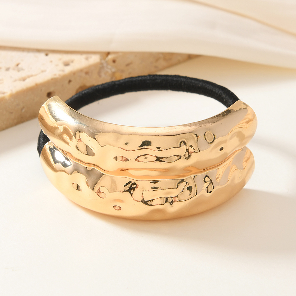 Viento frío europeo y americano, metal geométrico, anillo para el cabello elástico cóncavo y convexo, nuevo anillo para el cabello líquido de temperamento, cuerda para el cabello de alta elasticidad de todo fósforo