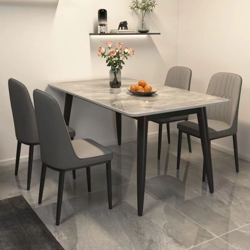 Fábrica directa mesa de comedor de tabla de roca ligera de lujo doméstica moderna simple mesas de comedor y sillas de hierro forjado combinación rectangular para comer