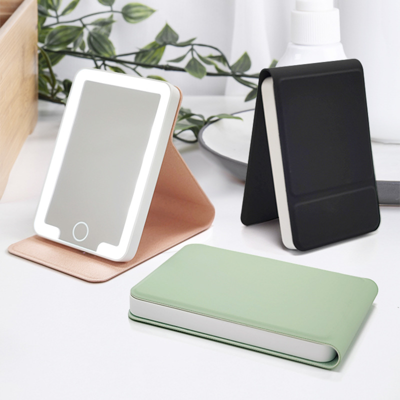 Mini espejo plano plegable de cuero impermeable transfronterizo con luz pequeña tapa abatible portátil portátil LED espejo de maquillaje de mano