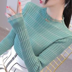 春と秋の新商品のハスの葉の襟の長袖のニットの女性は身を修めて洋風の中で底のシャツのネットの糸の木の耳元の上着を掛けます。