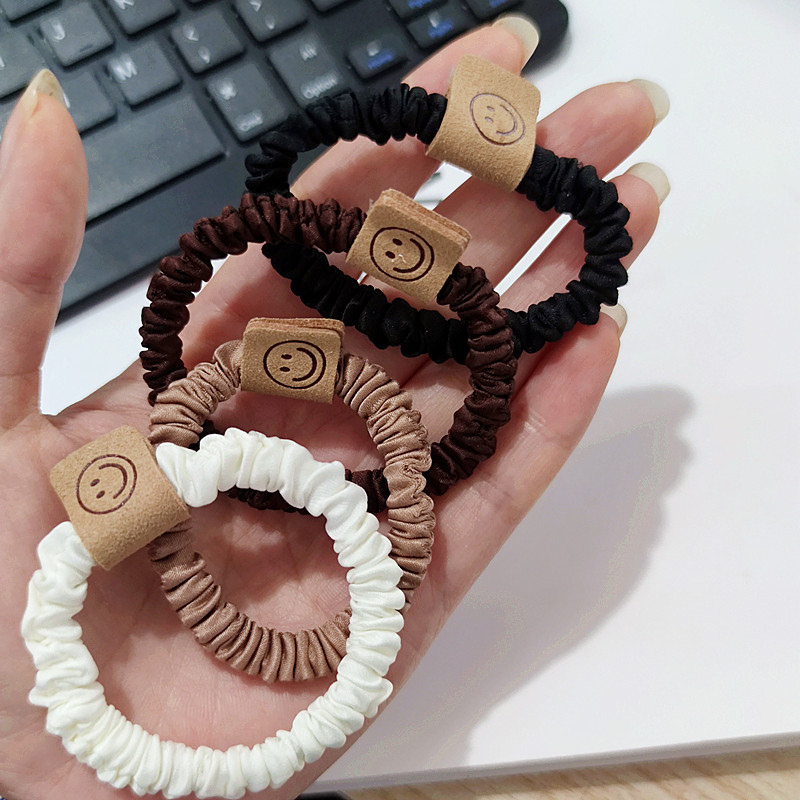 Brown smiley hair band