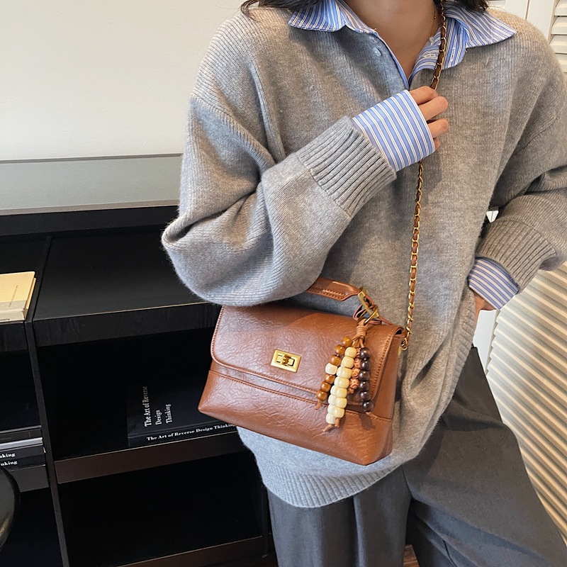 Cross-border 2025 otoño y invierno nuevo bolso de mano de alta calidad bolso cuadrado pequeño de textura de mujer bolso de hombro nicho bolso de mochila