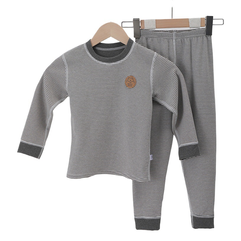 Niños y niñas de terciopelo traje de ropa interior térmica Otoño e Invierno forro de lana engrosada traje térmico de los niños deshuesado pijamas de fondo