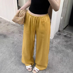 夏の新型黄色の亜麻のズボンはゆったりしています。
