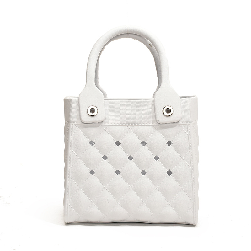 Bolso Tote de moda coreana 2025 verano nuevo estilo bolso femenino agujero hueco bolso de mano moda ringge bolso de playa marea