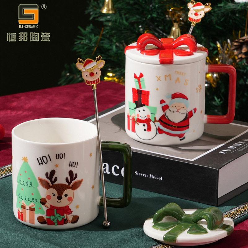 Nuevas tazas de cerámica creativas de Navidad tazas de café para parejas con cucharas para cubrir regalos de exportación