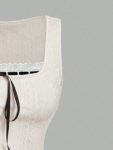 Elegant women's lace-trimmed, slim-fit, V-neck top in a milky white tone, exuding sweet, gentle, and charming temperament.