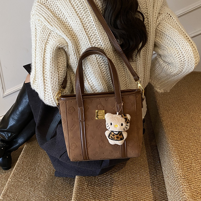 2025 otoño y invierno nuevo estilo simple de gran capacidad bolso de cubo portátil de mujer sensación de alta calidad bolsa de hombro casual bolsa de viaje mochila