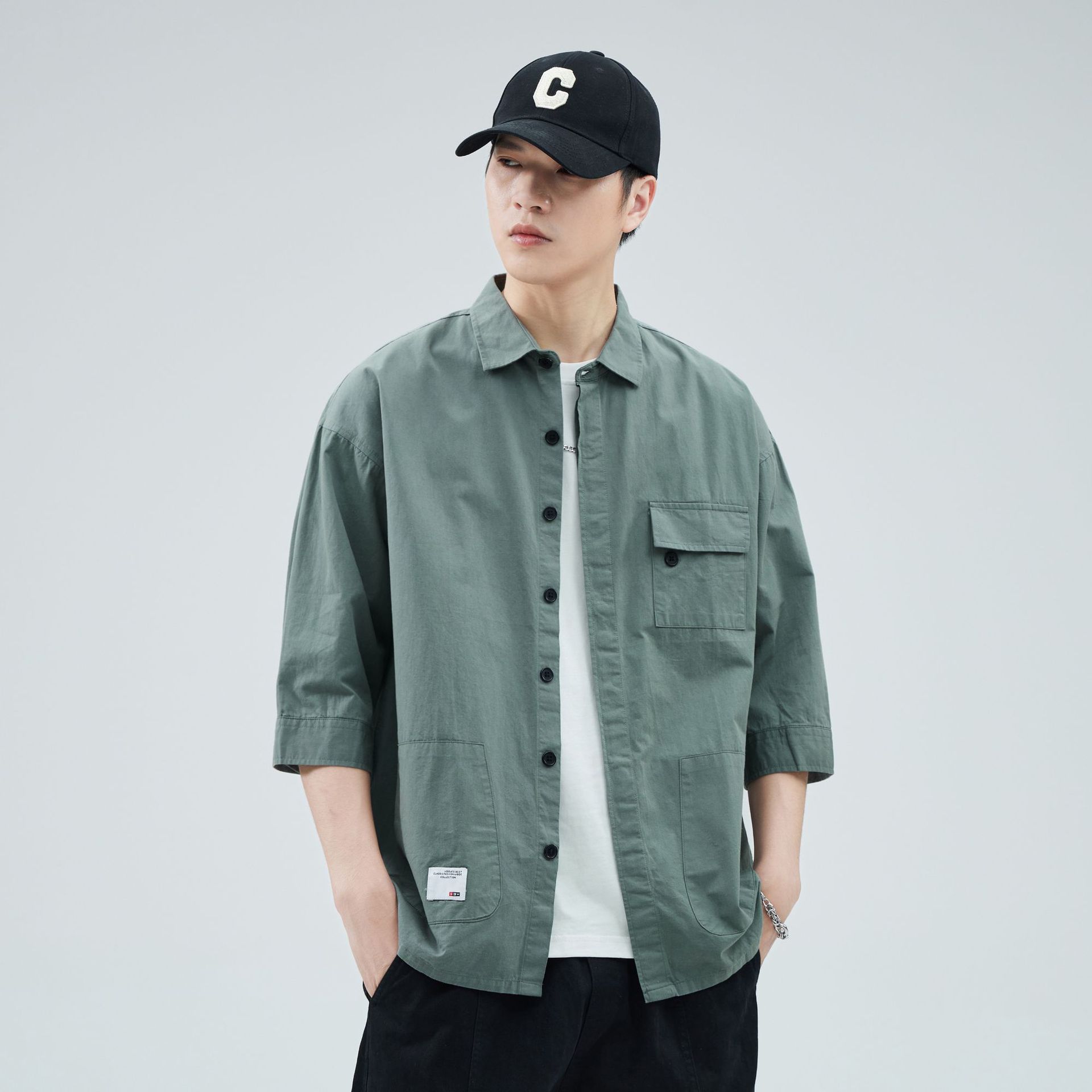 Camisa de trabajo holgada para hombre, primavera y verano, totalmente de algodón, estilo coreano, estilo americano informal, mangas tres cuartos, cuello único, bolsillo, transpirable y que absorbe la humedad.