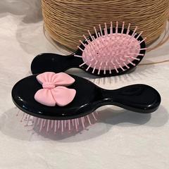 アニメのかわいい蝶結びのエアバッグの櫛のミルクの息のクッションの櫛の柔らかい妹の携帯マッサージの櫛のミニ櫛