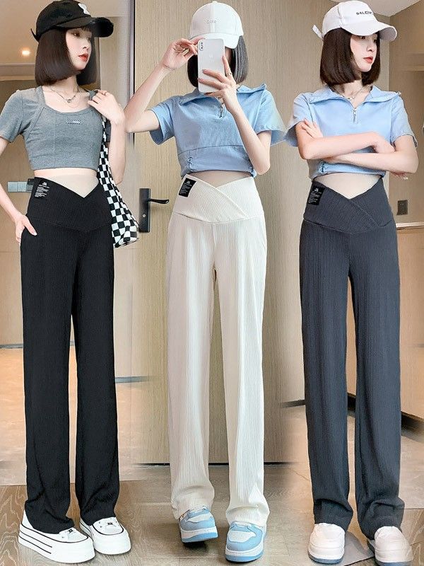 妊婦服のズボンの夏服の低い腰の氷の糸の広い足のズボンの春夏の薄い金の外は底を打つストレートのカジュアルなズボンの夏を着ます。