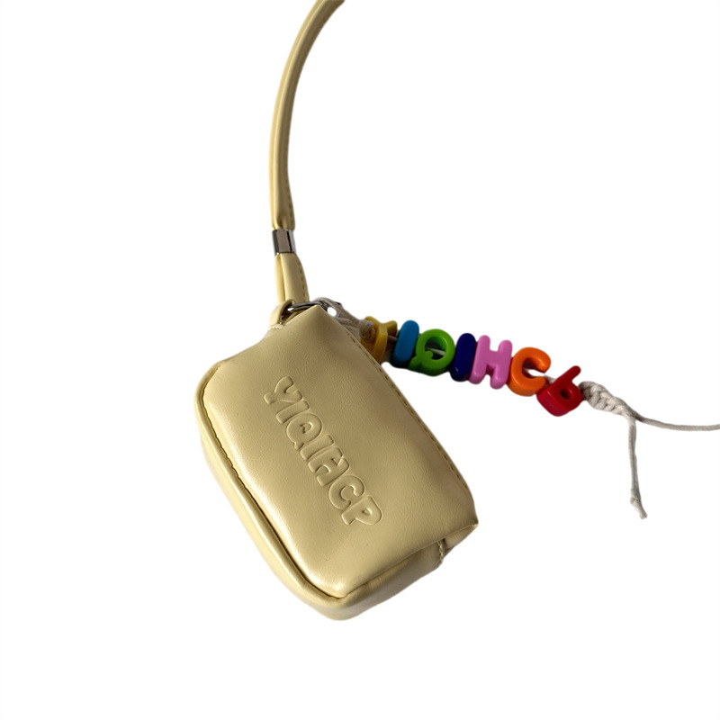 Bolsos para niños coreanos, tendencia de personalidad, mini bolso con cuello halter para niños y niñas 2025 nuevo bolso para auriculares, monedero para bebés