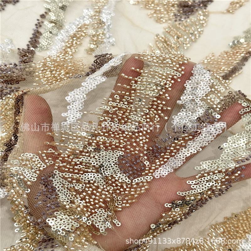 Tejido de encaje bicolor bordado de tubo de perlas 	Tejido de malla de sequilla vestido de boda transfronterizo tela bordada de moda