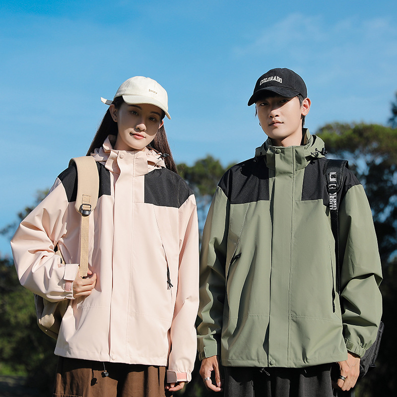 Primavera y otoño deportes al aire libre pareja de moda casual sombrero desmontable color a juego hombres y mujeres chaqueta delgada entrega en vivo