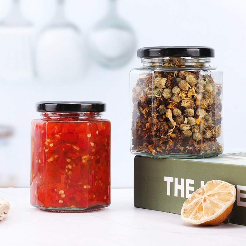 Botella de vidrio hexagonal espesada botella de miel sellada con tapa de crema de limón enlatado de salsa de Chile botella fábrica al por mayor