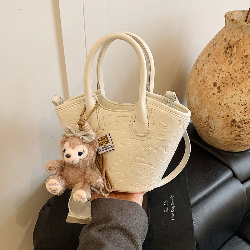 Nicho coreano bolsas de cesta de verduras de mano primavera de mujeres 2025 nueva moda encantadora bolsa en relieve bolsas de mochila