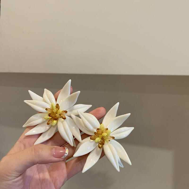 Pendientes de flor de lazo elegante de súper hada de plata Pendientes de moda de lujo ligero francés Pendientes de todo fósforo dulce de estilo literario