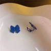 Blue ear clips with bow, no pierced ears