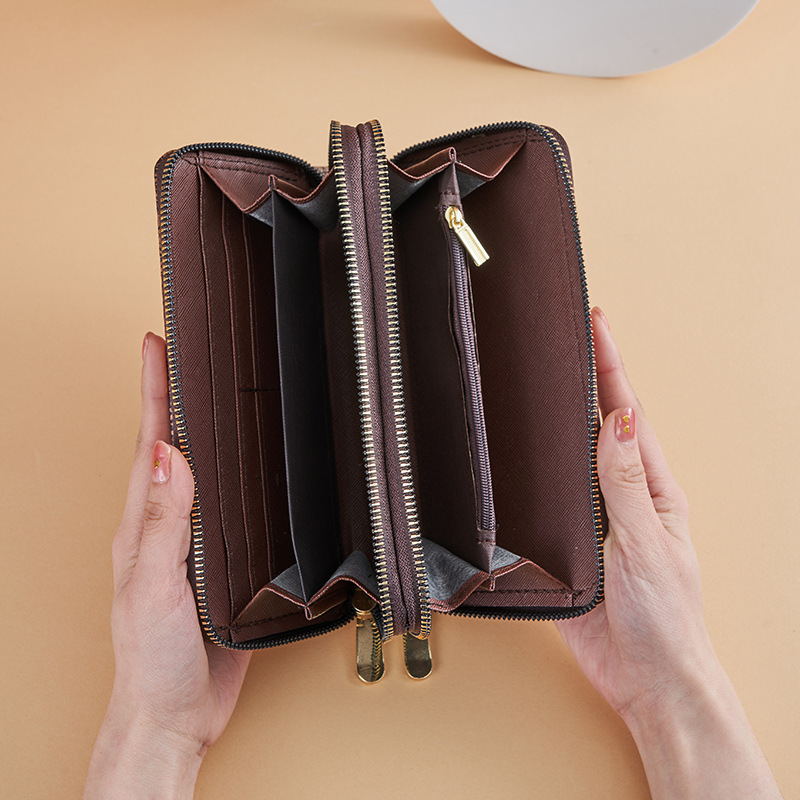 Cartera larga para mujer nueva 2025 popular europea y americana de gran capacidad con doble cremallera bolso para teléfono móvil bolso de mano con letras impresas