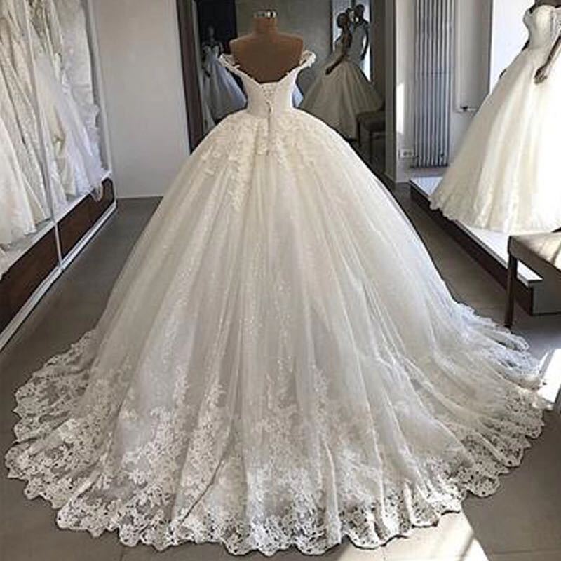 Vestido de novia principal cola grande europeo y americano transfronterizo blanco largo cuello en V francés adelgazamiento retro encaje vestido de novia fábrica al por mayor
