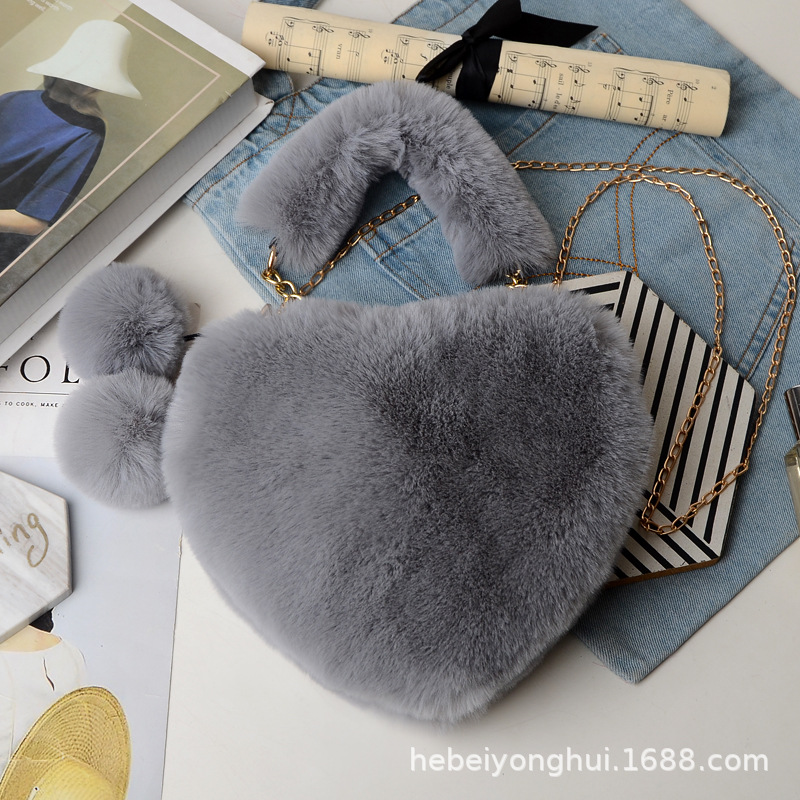 Fabricante en stock bolsa de corazón de melocotón portátil moda felpa en forma de corazón bolsa de peluche bolso de las mujeres