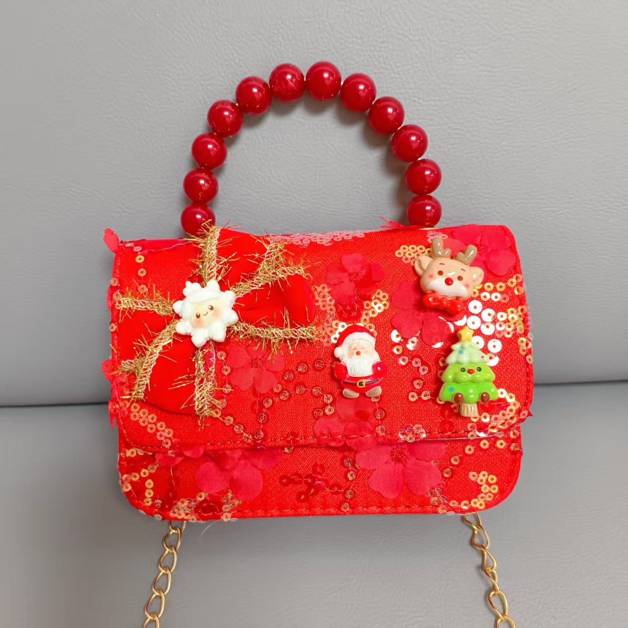 Cartera de Año Nuevo rojo arco de papá Noel bolso de perla pequeña cadena de viento fragante bolso de hombro